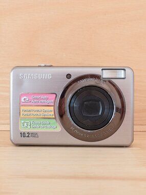Share Samsung PL50 SL202 10.2MP Compact Digital Camera 3x Optical Zoom Silver Te